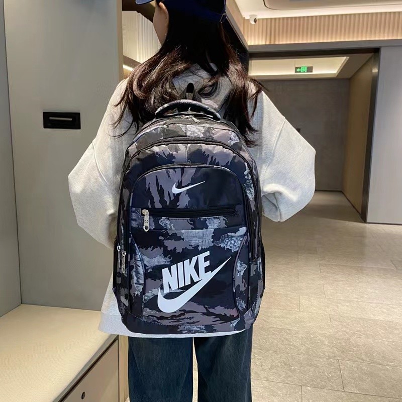 NIKEความจุขนาดใหญ่แฟชั่นผู้ชายและผู้หญิงพรางกระเป๋าเป้สะพายหลังสบาย ๆ