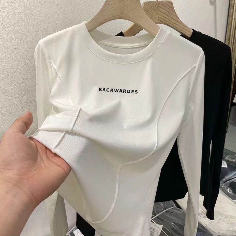 เสื้อยืดคอกลม แขนยาว ผ้ายืด สวมใส่สบาย ขนาดใหญ่ สีขาว แบบเรียบง่าย สไตล์ใหม่ สําหรับผู้หญิง