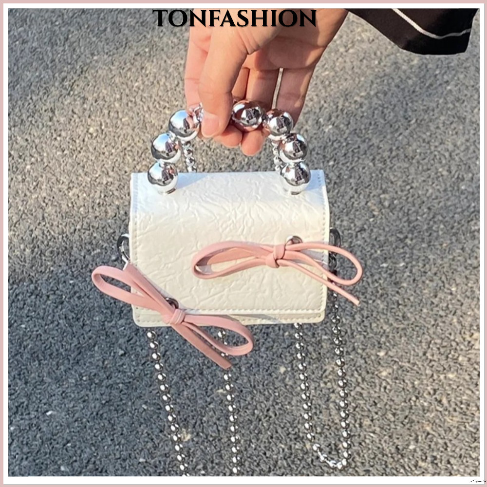 Tonfashion กระเป๋าสะพายไหล่ กระเป๋าถือ หนัง PU ประดับโบว์ ขนาดเล็ก ใส่หูฟังได้ แฟชั่นสําหรับสตรี
