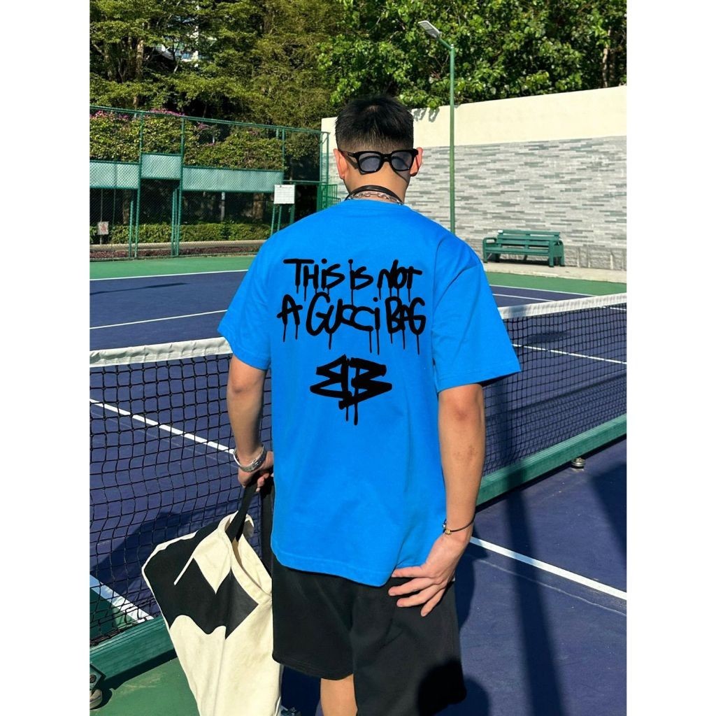 เสื้อยืดแขนสั้น คอปก พิมพ์ลายกราฟฟิติโลโก้ TOP B คุณภาพสูง แฟชั่นฤดูใบไม้ผลิ และฤดูร้อน สําหรับผู้ชาย และผู้หญิง