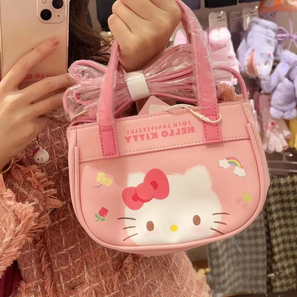 ใหม่ กระเป๋าสะพายไหล่ ลายแมว hellokitty ครบรอบ 50 ปี แบบพกพา แฟชั่นฤดูใบไม้ผลิ สําหรับเด็กผู้หญิง