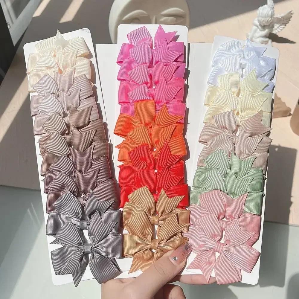 10 ชิ้นที่มีสีสัน Grosgrain ริบบิ้นโบว์กิ๊บสําหรับสาวน่ารัก Cheer Bowknot Hairpin Barrettes Headwear เด็กอุปกรณ์เสริมผม