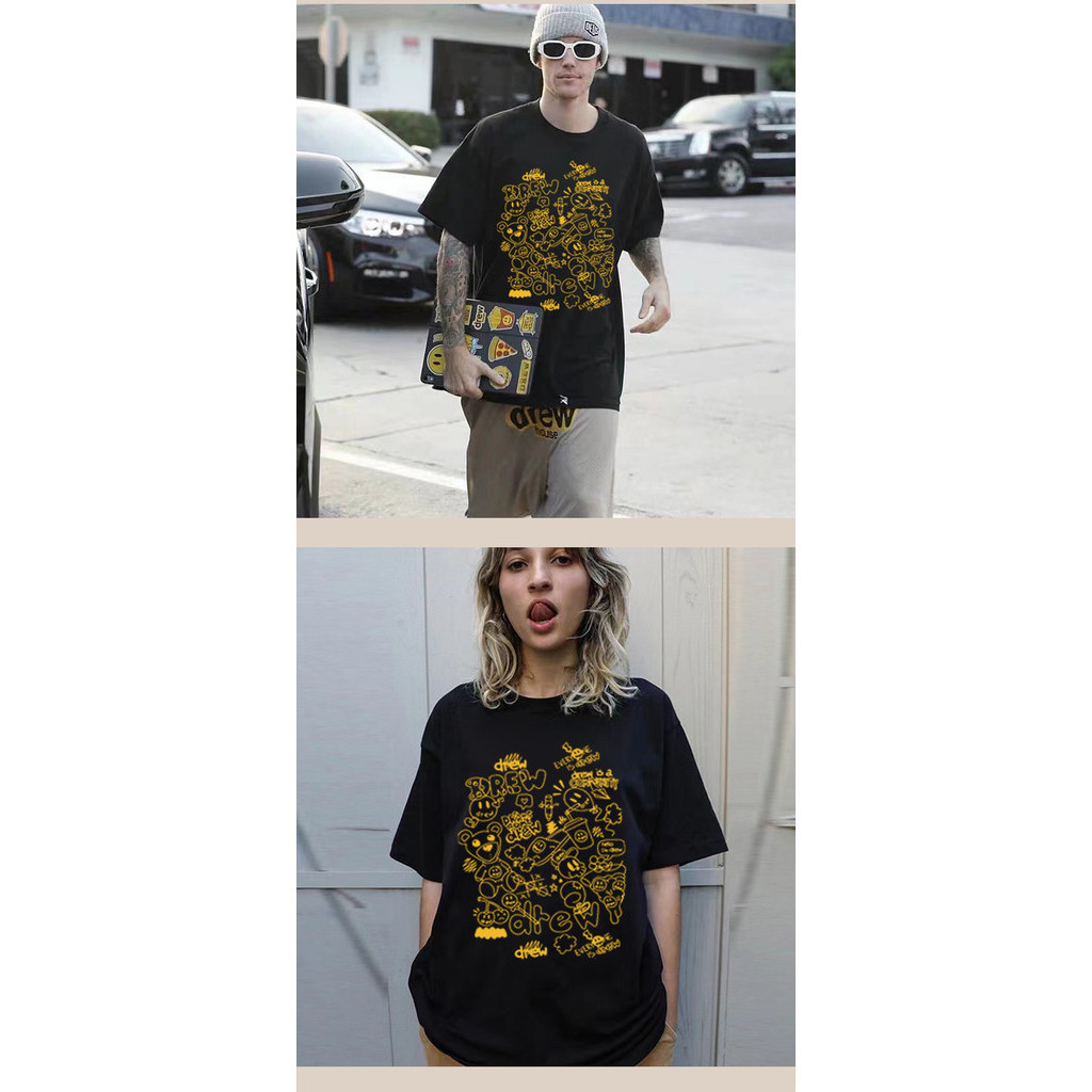 Drev เสื้อยืดแขนสั้นลําลอง พิมพ์ลายหน้ายิ้ม ทรงหลวม แฟชั่นคู่รัก สําหรับผู้ชาย และผู้หญิง