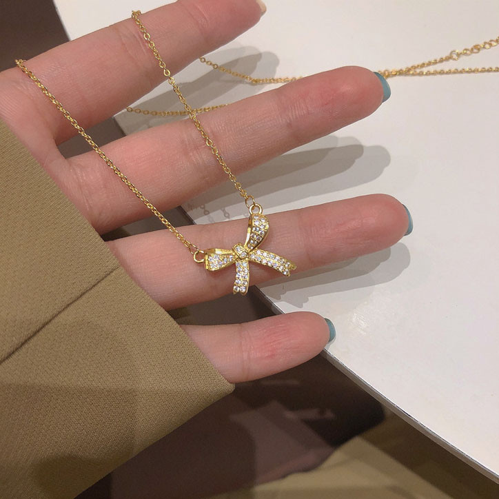 สร ้ อยคอโบว ์ สร ้ อยคอกระดูกไหปลาร ้ า Rhinestone ที ่ สวยงาม