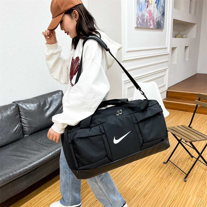 Nikeกระเป๋าเดินทางแฟชั่นความจุขนาดใหญ่สำหรับผู้ชายและผู้หญิง(ความยาว 58.กว้าง 24. สูง 32)