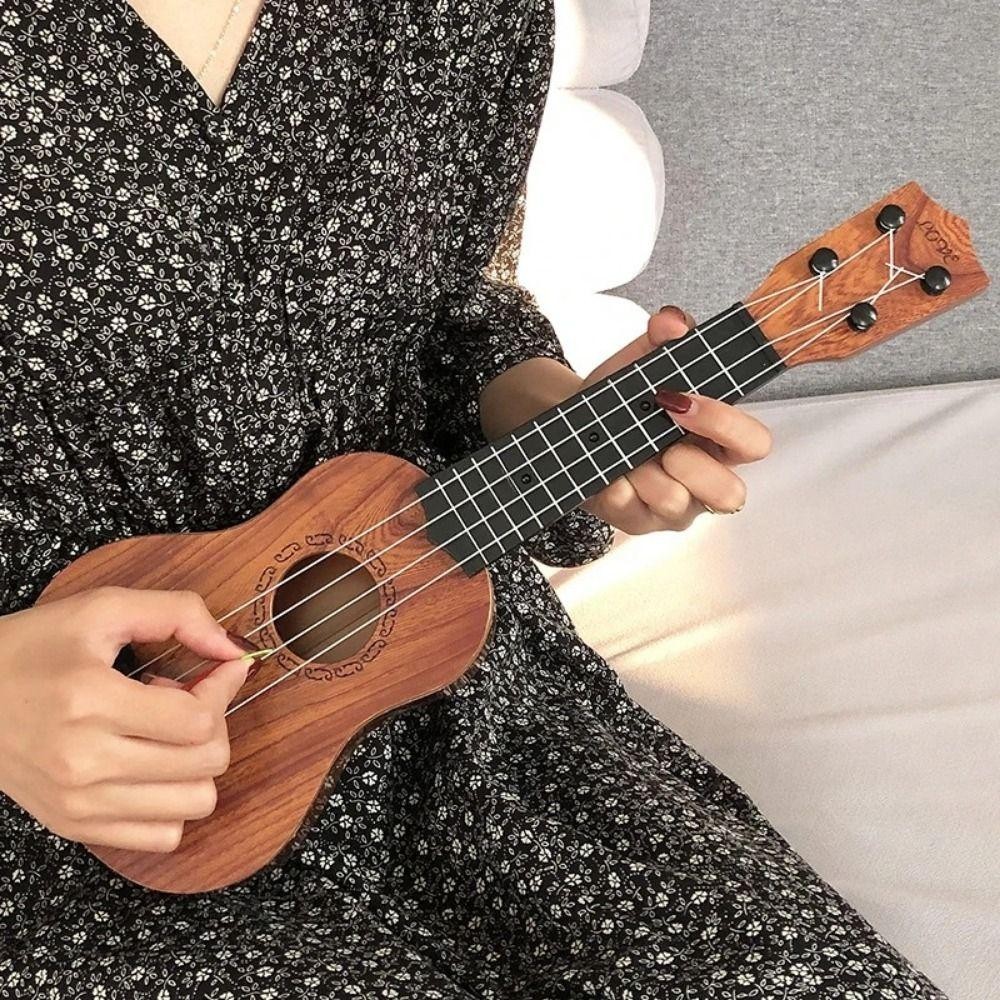 SWIFTSAVER จําลอง Ukulele ของเล่น,ปรับ String Knob คลาสสิก Ukulele เครื่องดนตรีของเล่น,โรงเรียนเล่นเกม Yukrili ของเล่น Playable ทนทานกีตาร์ขนาดเล็กของเล่นเกมกลางแจ้ง - รูปที่ 2