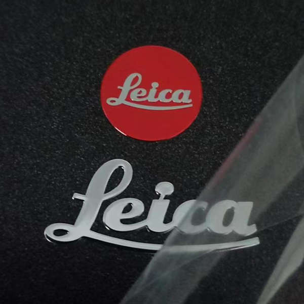 LEICA LEICA เหมาะสําหรับกล้อง SLR DIY สติกเกอร์โลหะโลโก้สติกเกอร์ด้านหลังมือตกแต่งสติกเกอร์โลหะ