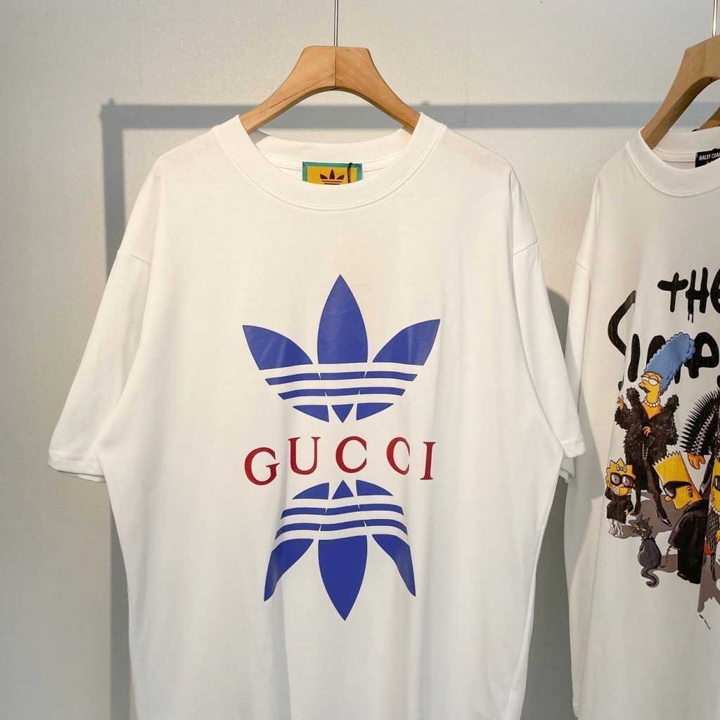ใหม่ เสื้อยืดลําลอง ผ้าฝ้ายแท้ แขนสั้น คอกลม พิมพ์ลายตัวอักษร และป้ายแท็ก สไตล์สตรีทอเมริกัน สําหรับผู้ชาย และผู้หญิง