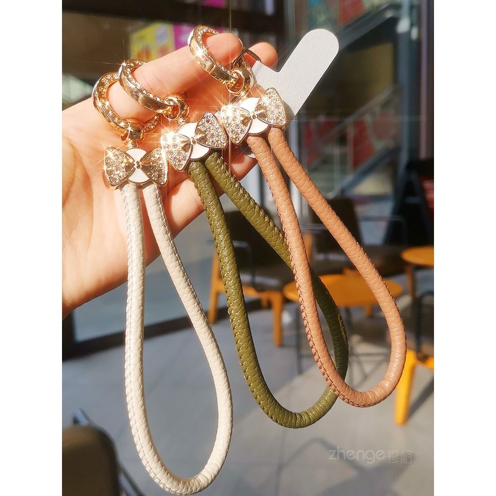 [พีดีเอ็ม] แสงหรูหรากระพริบเพชรสีหนังโทรศัพท์มือถือเชือกเส้นเล็กหญิง อิน แฟชั่นเรียบง่ายเชือกสั้นกุทัณฑ์เสน่ห์สายรัดข้อมือกรณีโทรศัพท์มือถือสากลสายมื