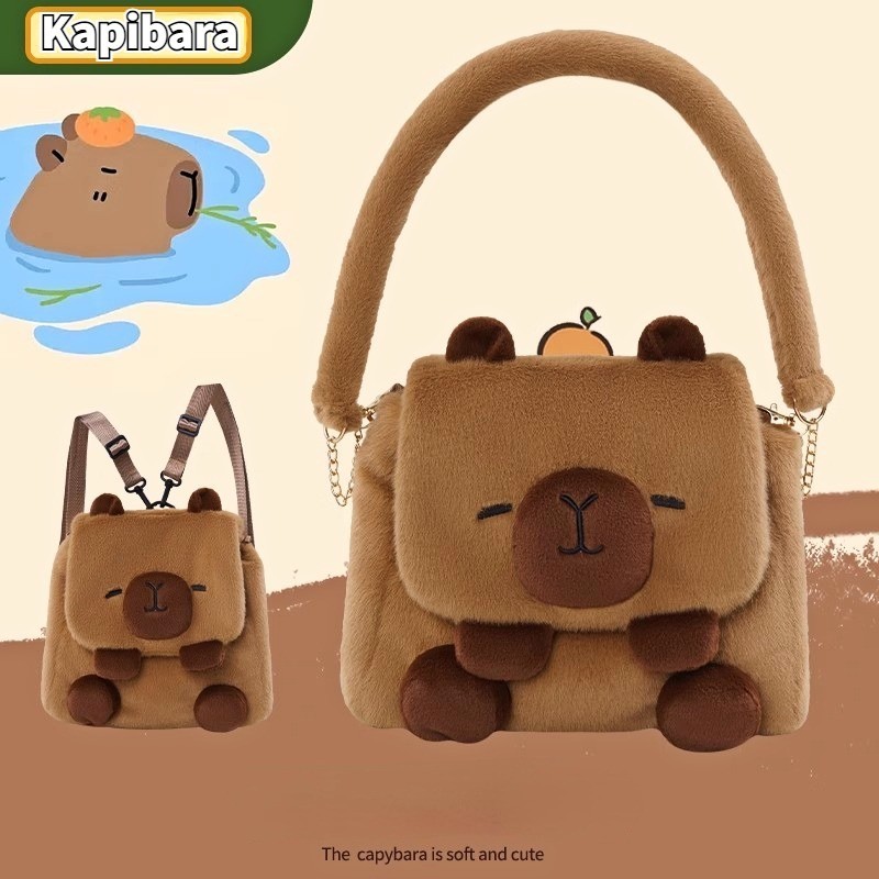 กระเป๋าเป้สะพายหลังตุ๊กตา Capibala น่ารัก Ins ใหม่สาวหัวใจโง่น่ารัก Capybara นักศึกษาวิทยาลัยกระเป๋าสะพายข้างอุปกรณ์ต่อพ่วงแฟชั่น