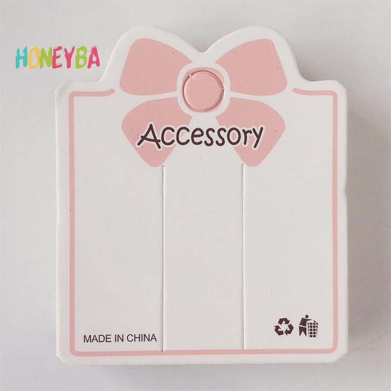 <Honeyba> 50pcsสีชมพูbowknot 2 รูขุมขนแสดงกระดาษการ์ดแท็กสําหรับสร้อยข้อมือเครื่องประดับอุปกรณ์เสริมผมผู้ถือบรรจุภัณฑ์เครื่องมือขนาดเล็กNice