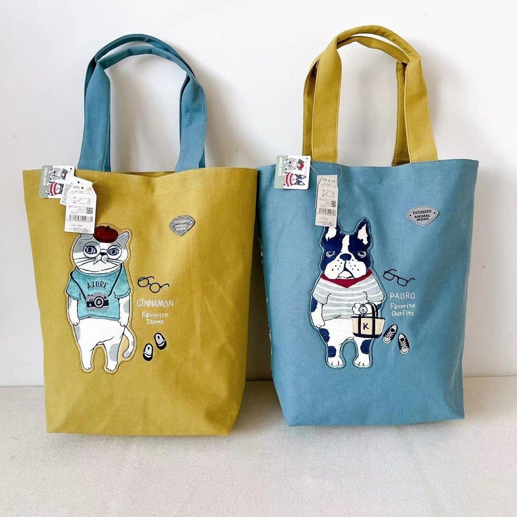【แบรนด์ญี่ปุ่น】Kusuguru กระเป๋าสะพาย/ถือแมวและหมา Bulldog ยืดหยุ่นเย็บปัก ใช้สำหรับโรงเรียนและการทำงาน มีหลายกระเป๋า ชนิดพันธุ์ สวยงามและน่ารักคาร์ตูน