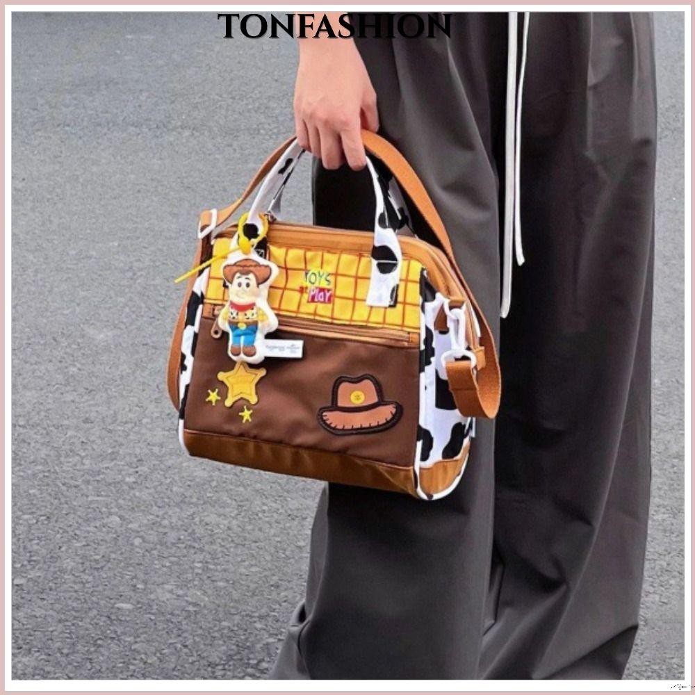 Tonfashion กระเป๋าสะพายไหล่ ผ้าแคนวาส ทรงโท้ท ขนาดใหญ่ จุของได้เยอะ แต่งซิป ลายการ์ตูนตลกน่ารัก