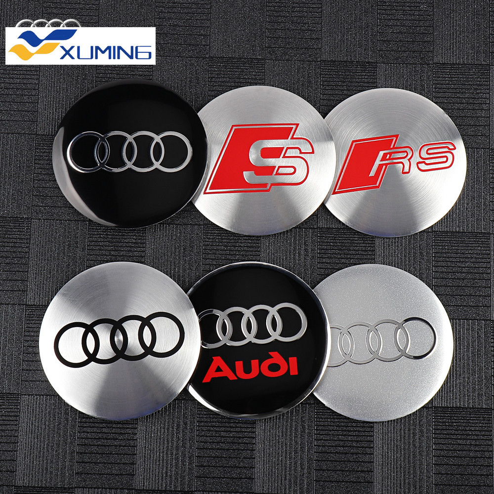 Xm-56/60/65/68 มม.4PCS รถล้อ Hub Caps ป้ายสัญลักษณ์สติกเกอร์ตกแต่งสําหรับ Audi S RS A4 B8 B6 B9 B7 A