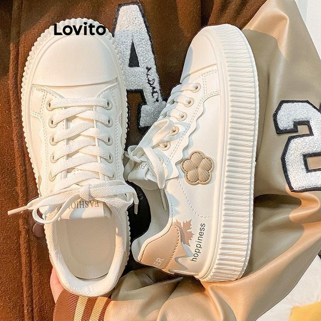 Lovito รองเท้าผ้าใบผู้หญิง แต่งปะ ลายดอกไม้ สีพื้น สไตล์ลำลอง LFA41332