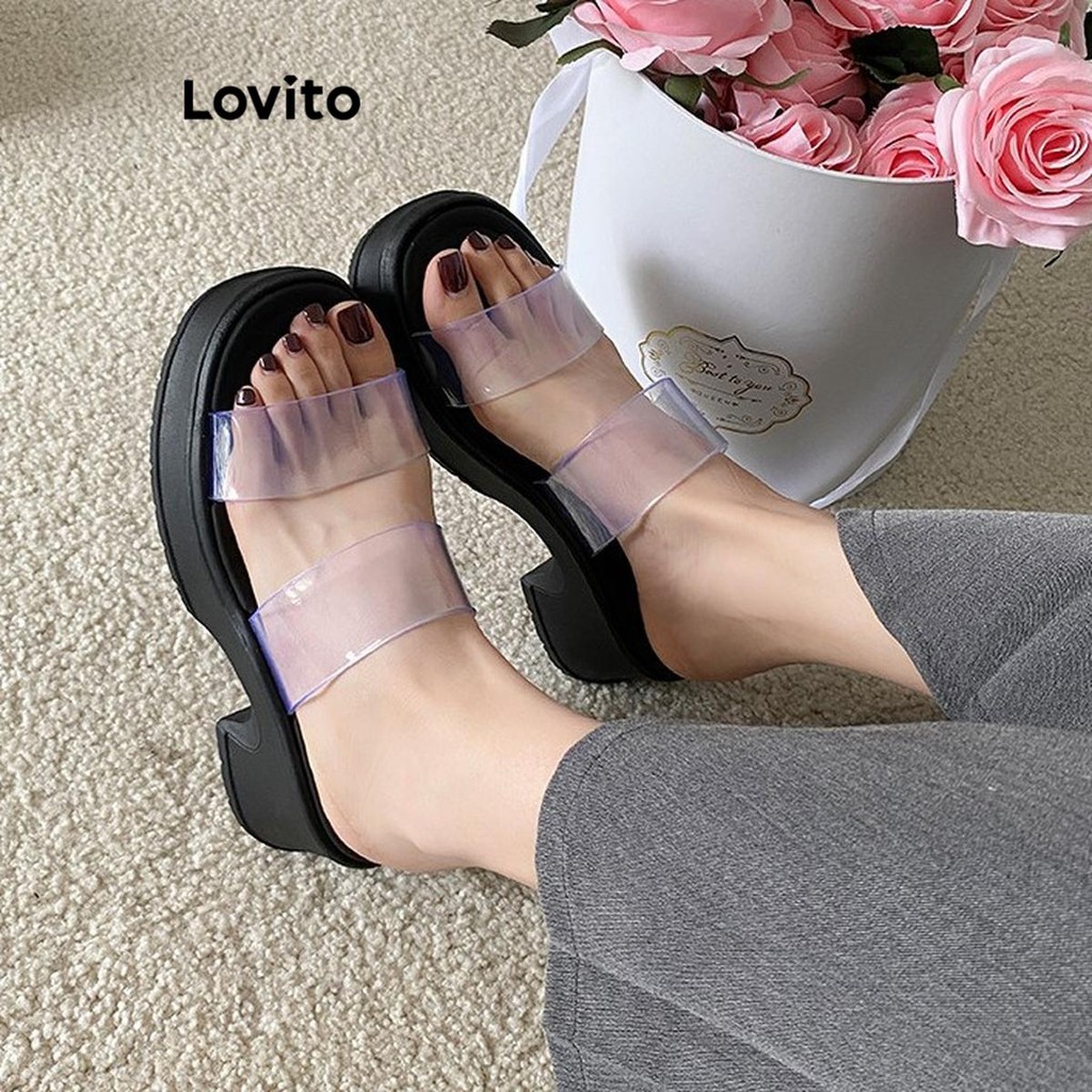 Lovito ลําลองธรรมดาอเนกประสงค์โปร่งใสพื้นหนาเพิ่มความสูงป้องกันการลื่นสวมใส่ด้านนอกรองเท้าแตะแบนสําหรับผู้หญิง  LFA62260