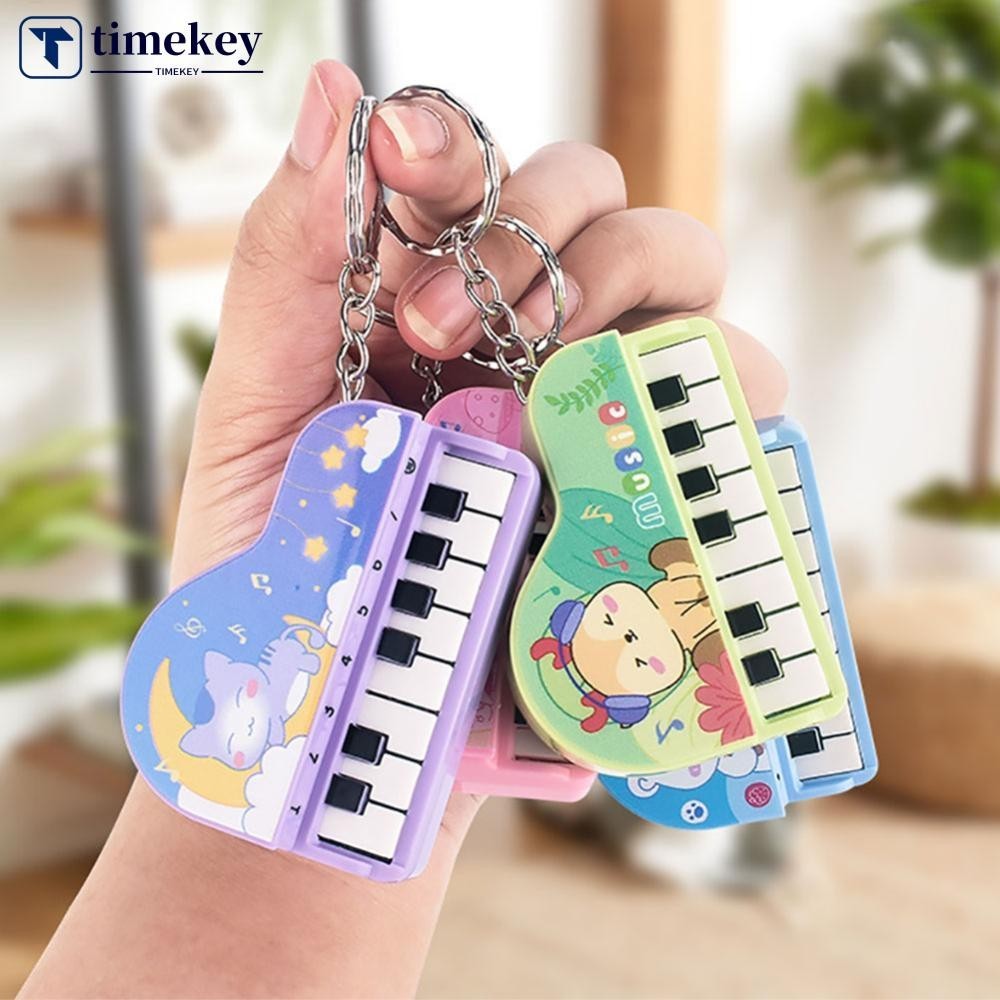 Timekey เปียโนอิเล็กทรอนิกส์ขนาดเล็กพร้อมการฝึกแสงเปียโนนิ้วพวงกุญแจคีย์บอร์ดเปียโนเครื่องดนตรีแบบพกพาของเล่นพวงกุญแจ J3Z4