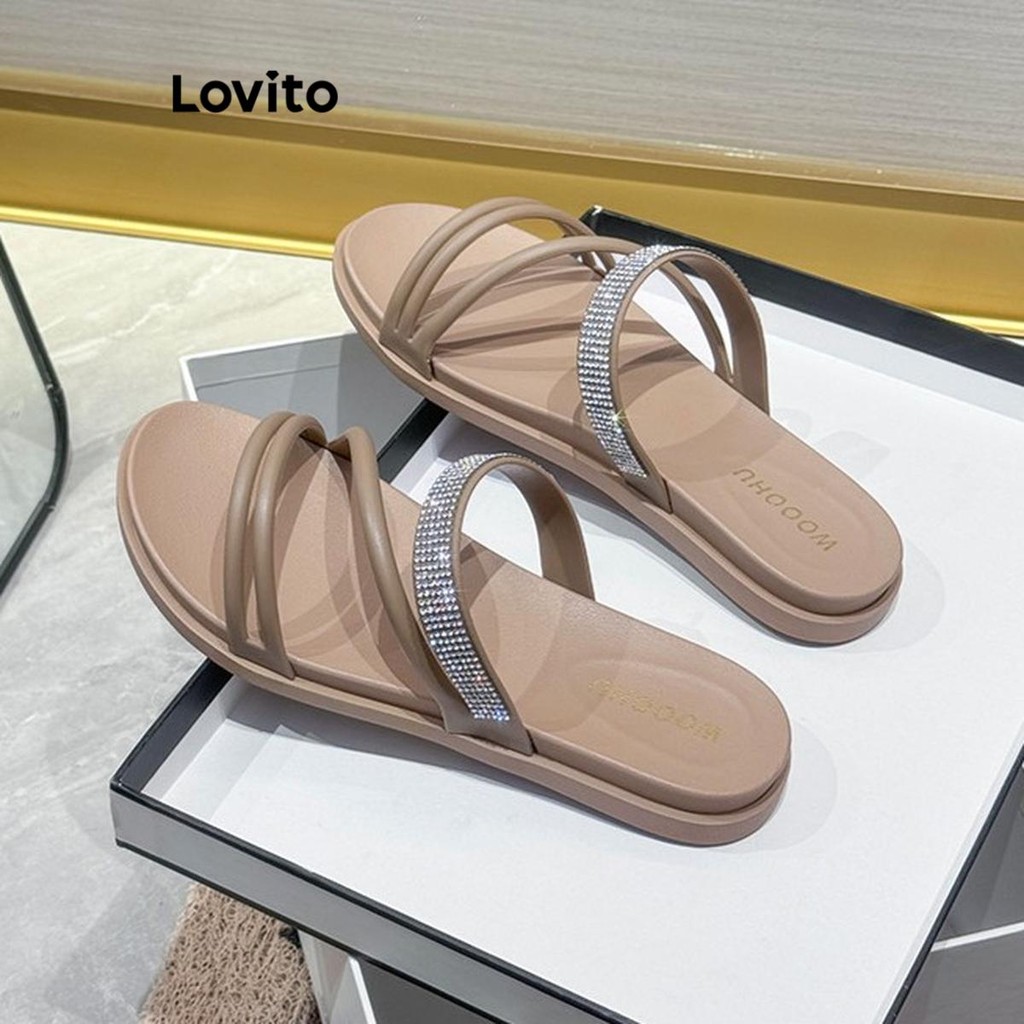Lovito ลำลองสีพื้นFlash Diamond ไขว้อเนกประสงค์หนาป้องกันการลื่นด้านล่างนุ่มสวมใส่ด้านนอกรองเท้าแตะแบนสําหรับผู้หญิง  LFA67222