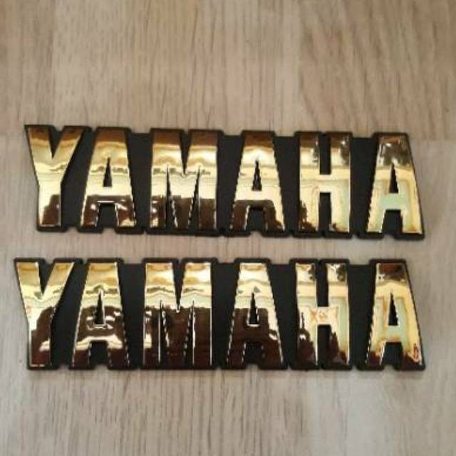 A PAIR OF YAMAHA RX KING TANK LOGO EMBLEMS