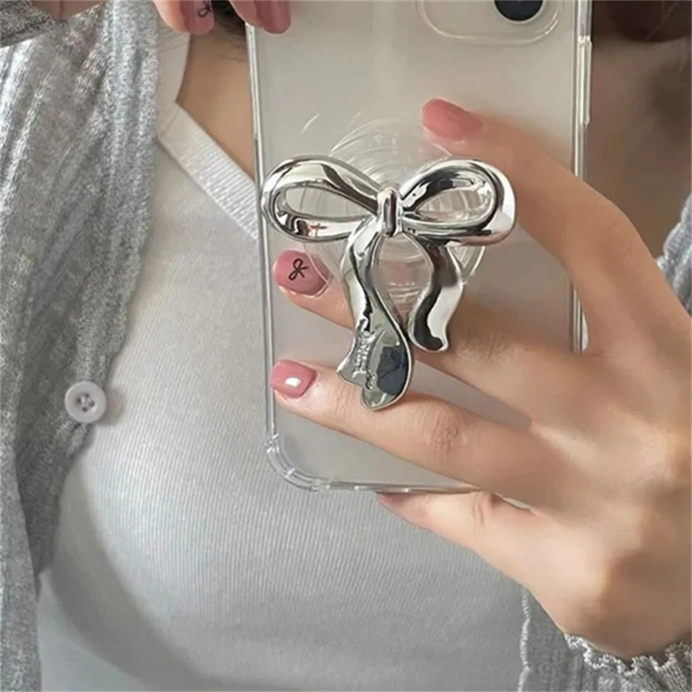 Ins เกาหลีเงิน Bowknot Griptok ใสโทรศัพท์แหวนนิ้วผู้ถือขาตั้งรองรับสําหรับ iPhone Samsung ซ็อกเก็ตพับได้สาววงเล็บ