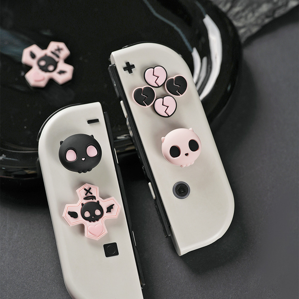 Geekshare ฝาครอบปุ่มกด ธีมกะโหลก สีชมพู สําหรับ Nintendo Switch และ Switch OLED