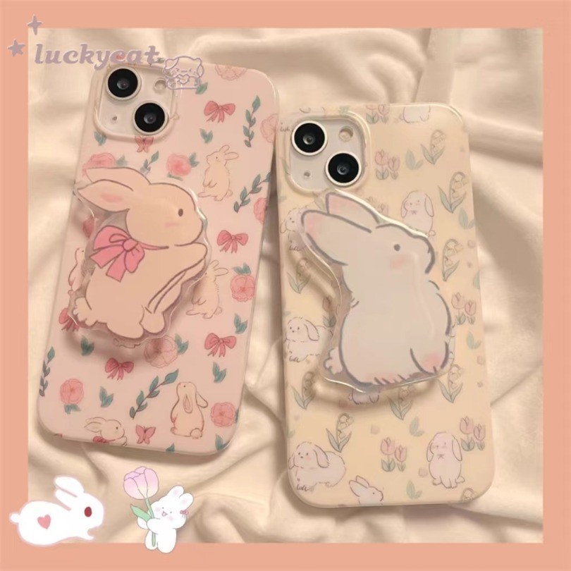 เคสโทรศัพท์มือถือ แบบนิ่ม ลายการ์ตูนกระต่ายน่ารัก ประดับโบว์ พร้อมขาตั้ง สีดํา สําหรับ iPhone 15 14 13 12 11 Pro Max X Xr Xs Max 7 8 Plus SE2020