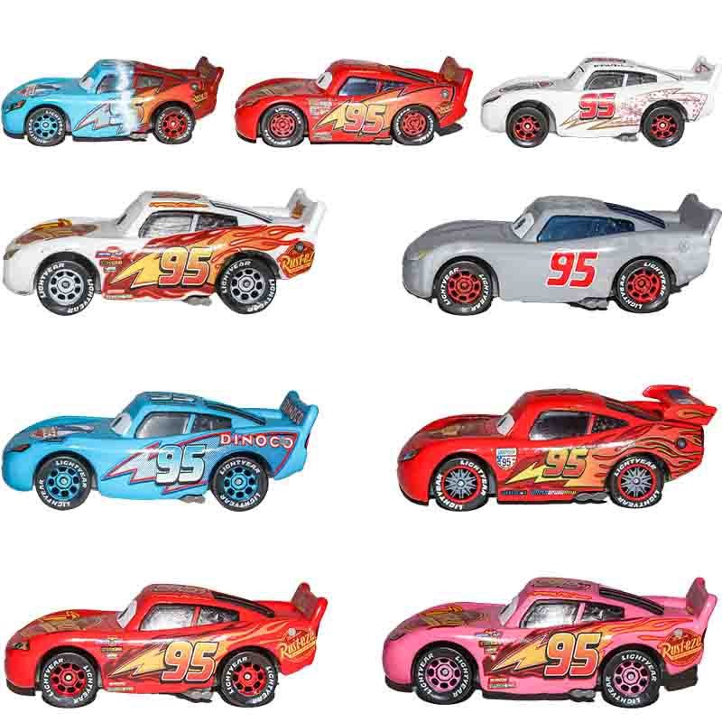 Disney Pixar Cars 2 3 Lightning McQueen ไดโนเสาร์สีสันสดใสสองด้านสีเทา McQueen รุ่นแรกถึงรถแข่งรุ่นที่สามโมเดลรถของเล่นเด็กโลหะผสม