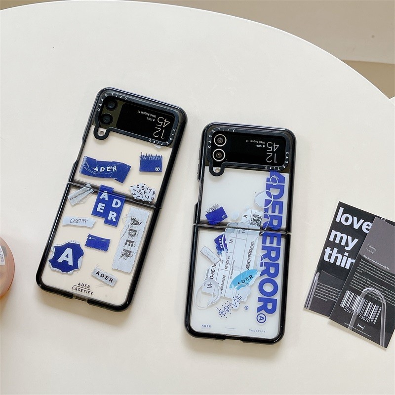 Samsung Galaxy Z Flip5 แฟชั ่ นเคสโทรศัพท ์ หน ้ าจอพับ Z Flip4 Z Flip3 แฟชั ่ นที ่ ไม ่ ซ ้ ํากัน casetify พับ ADER Co-Branded Creative Shock-resistant กรณี