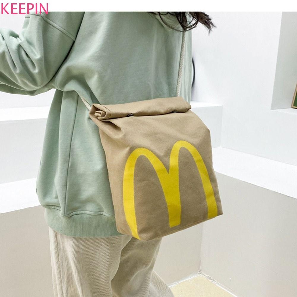 Keepin McDonalds กระเป๋าเป้สะพายหลังถุงอาหารกลางวัน Ins Letter ความจุขนาดใหญ่ผู้หญิงแล็ปท็อปกระเป๋าเป้สะพายหลังผู้ชาย Camping กระเป๋าเป้สะพายหลังสาวไหล่กระเป๋า Crossbody กระเป๋า
