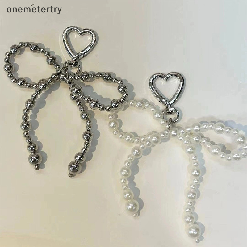 Onem Insสไตล์Bowknotลูกปัดจี้โทรศัพท์Love Buckle Key Chain Silver HeartหูฟังCharmกระเป๋าDecorรถKeyแหวนN