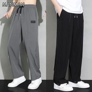 MANMAN ผู้ชายสีล้วน การออกแบบเชือกรัดเอว กางเกงกีฬาลำลองทรงห…