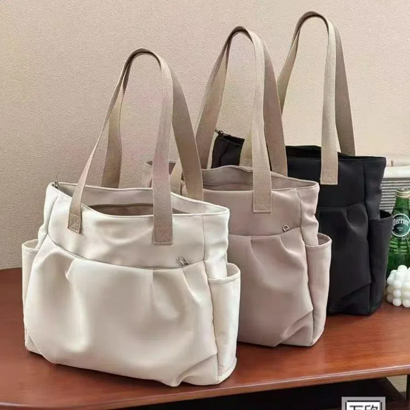 ใหม่ผ้าใบสีทึบญี่ปุ่นความจุขนาดใหญ่ Tote กระเป๋าร้อยอเนกประสงค์ Commuting กระเป๋าสะพายผู้หญิงกระเป๋าถือลําลอง