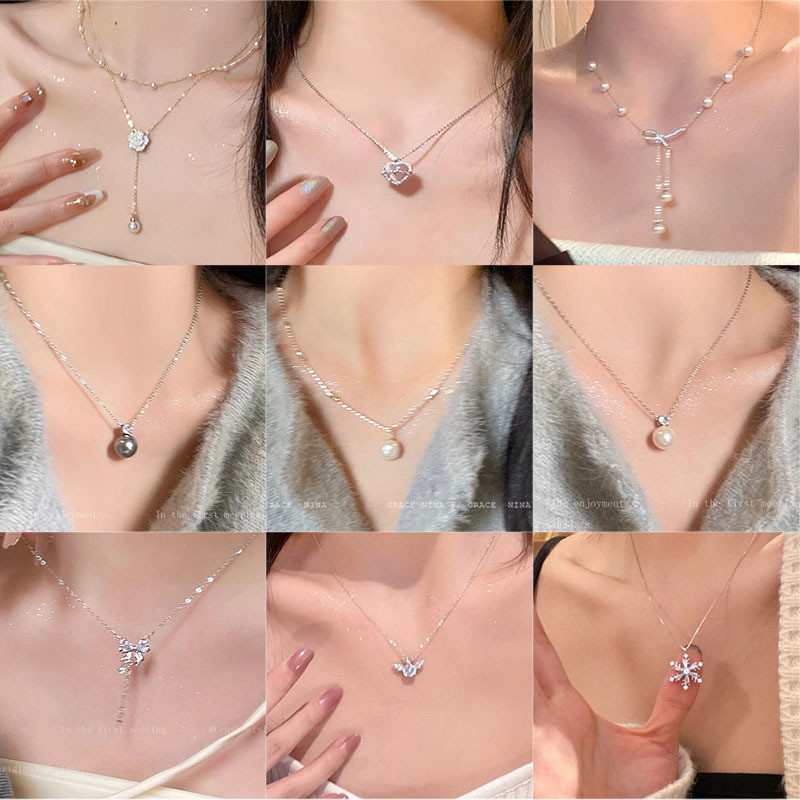 ซื้อ 4 แถม 1 ของขวัญสร้อยคอเหล็กไทเทเนียมวินเทจสําหรับผู้หญิงร้อยจี้มุกลมนิชโซ่ไหปลาร้าสาว