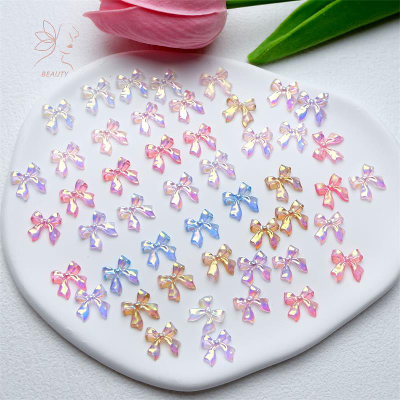 [maybeauty] 50 ชิ้น/ถุง 3D Bowknot ตกแต่งเล็บที่มีสีสัน Aurora Super Fairy Bow Nail Art Ch สาว DIY แฟชั่นอุปกรณ์แต่งเล็บ {TH}