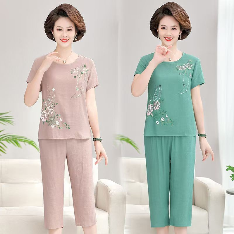 เสื้อยืดคอกลมแขนสั้นลายดอกไม้ผู้หญิงชุดลําลอง + กางเกงขายาวสองชิ้นขากว้างตรงแฟชั่นใหม่ชุดหลวมทุกการแข่งขัน