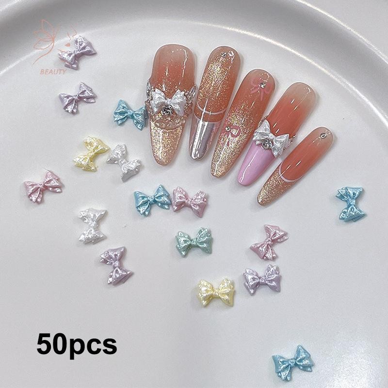 [maybeauty] 50pcs Pearlescent 3D Nail Art Bow Charm สําหรับเล็บตกแต่งออกแบบ Kawaii อุปกรณ์ทําเล็บ Bow-knot DIY Craft Supplies {TH}