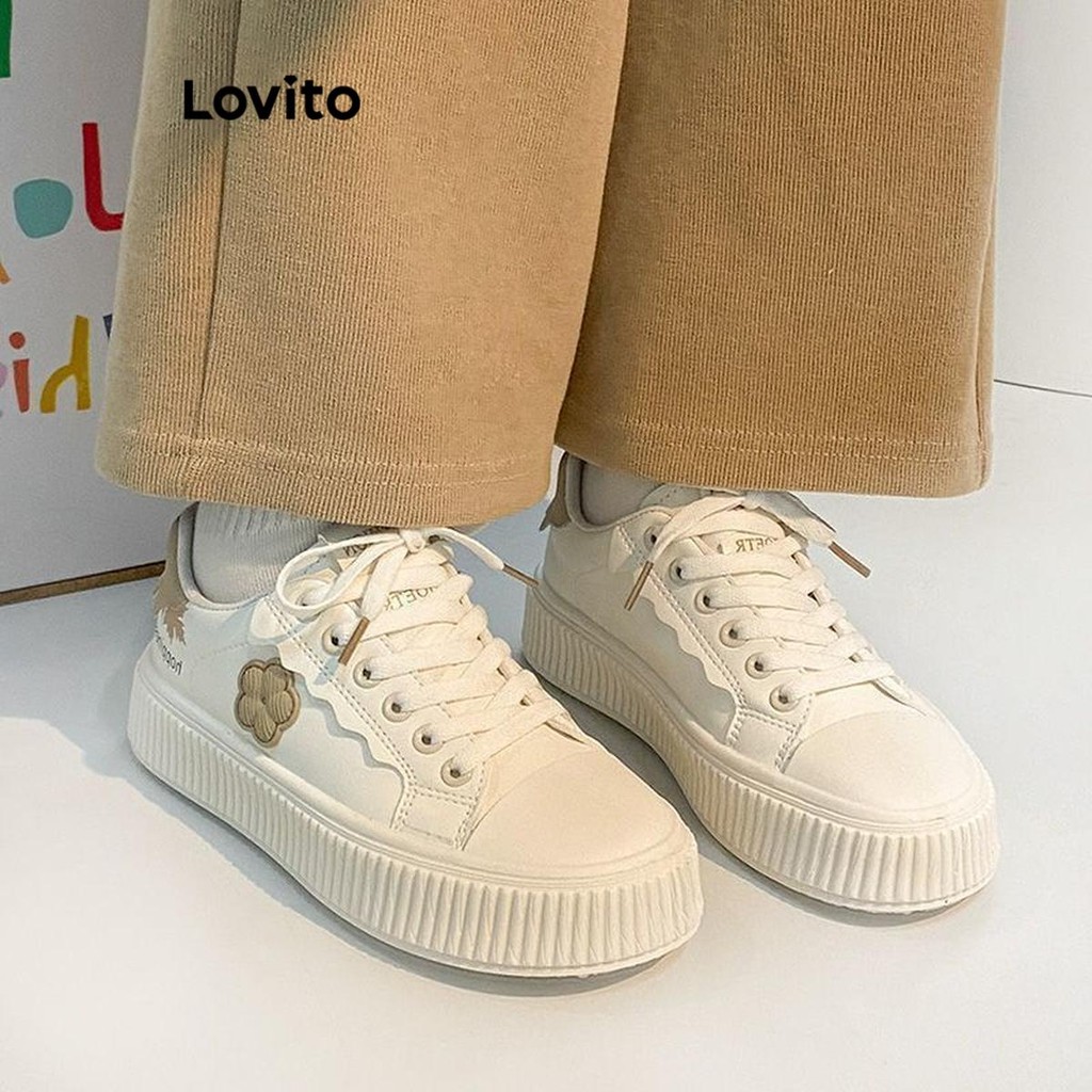 Lovito รองเท้าผ้าใบผู้หญิง แต่งปะ ลายดอกไม้ สีพื้น สไตล์ลำลอง LFA41332