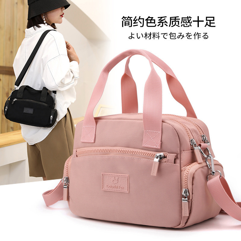 สาวสไตล์ใหม่กระเป๋าสะพายสีทึบความจุขนาดใหญ่หลายชั้นกระเป๋าสะพาย Casual All-Match Messenger กระเป๋ากันน้ํา Anti-Theft Oxford ผ้าไหล่