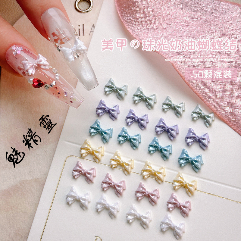 50 ชิ้น อุปกรณ์ตกแต่งเล็บรูปโบว์สีครีมมุกน่ารัก สีเหมือนมาการอง ทำจากเรซิน