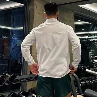 MANSTR สไตล์อเมริกันผู้ชายครึ่งซิปแขนยาวเสื้อยืดแห้งเร็วกีฬาด้านบนขี่จักรยานวิ่งออกกําลังกายการฝึกอบรมแฟชั่นที