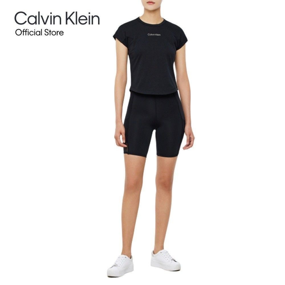 CALVIN KLEIN กางเกงเลคกิ้งขาสั้นผู้หญิง CK Performance รุ่น 4WF3L720 001 - สีดำ