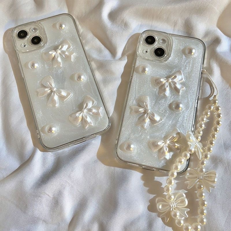 เคสโทรศัพท์มือถืออะคริลิค ใส ประดับโบว์ ไข่มุก และจี้หัวใจ 3D พร้อมสายคล้อง สไตล์เกาหลี สําหรับ iPhone 17Pro Max17 Air16 15 14 12 11 Pro MAX XS MAX XR