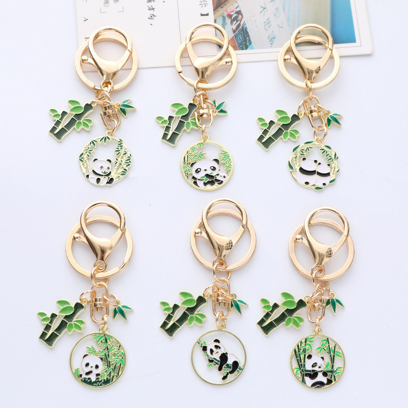 แฟชั ่ นสไตล ์ จีนน ่ ารัก Panda พวงกุญแจผู ้ หญิง Drop Glaze ใบไม ้ ไผ ่ สีทอง Keychian กระเป ๋ าจี ้ เครื ่ องประดับสาวของขวัญ