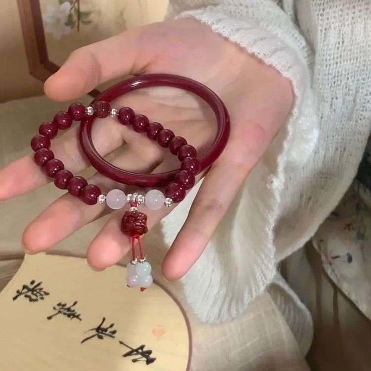 ใหม่สไตล์จีนย้อนยุคสิงโตสร้อยข้อมือลูกปัดนาตาลปีซอกความรู้สึกขั้นสูงของหรูหราชาดกริ๊งสร้อยข้อมือเครื่องประดับ