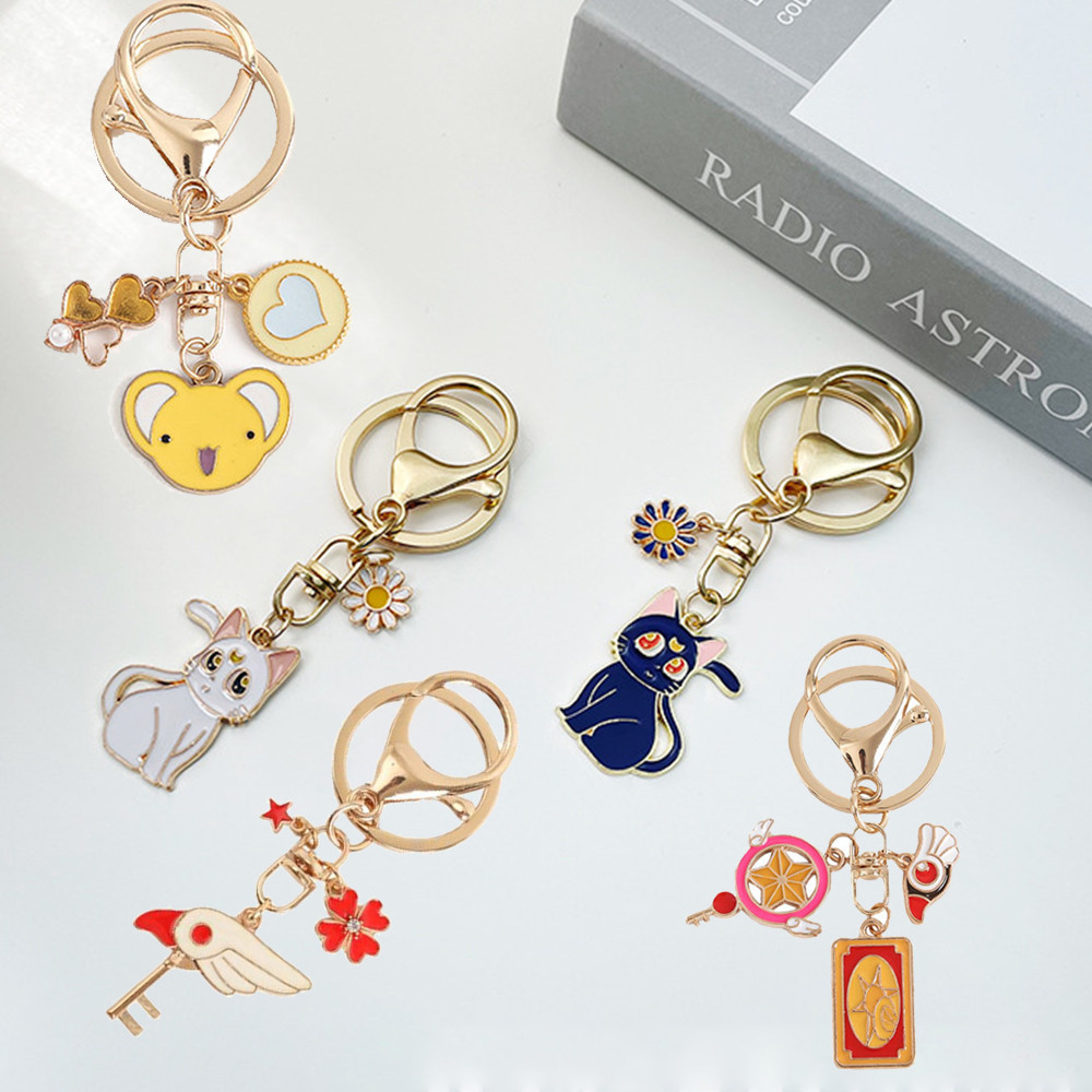 Kawayi การ์ตูนการ์ด Captor Sakura พวงกุญแจแมวน่ารักแหวน Moon ดอกไม้จี้สาวน่ารักกระเป๋าเครื่องประดับ
