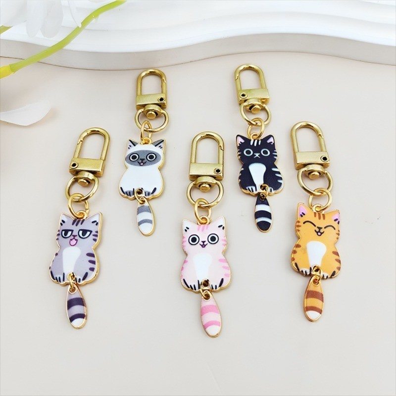โลหะน ่ ารักการ ์ ตูนแมวพวงกุญแจที ่ มีสีสันแมวหาง Kitty สัตว ์ พวงกุญแจสําหรับผู ้ หญิงผู ้ ชายหูฟังรถกระเป ๋ าถือจี ้ ของขวัญ