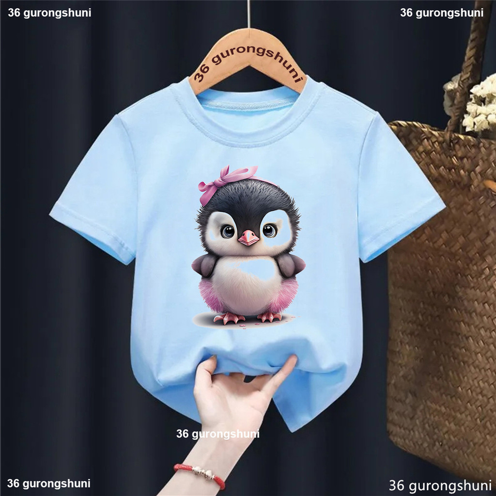 2024 สาวขายร้อนเสื้อยืดตลกเพนกวินการ์ตูนพิมพ์เด็ก เสื้อยืด แฟชั่นอินเทรนด์สาวเสื้อผ้าของขวัญวันเกิด เสื้อยืด ฤดูร้อนเด็กท็อปส์
