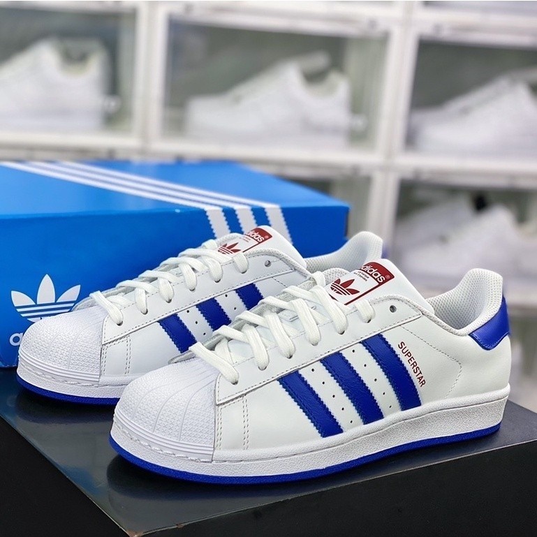 Adidas Superstar Low สบายคลาสสิกสีขาวสีฟ้ารองเท้าสเก็ต Unisex รองเท้าผ้าใบสําหรับผู้ชายผู้หญิง S7494