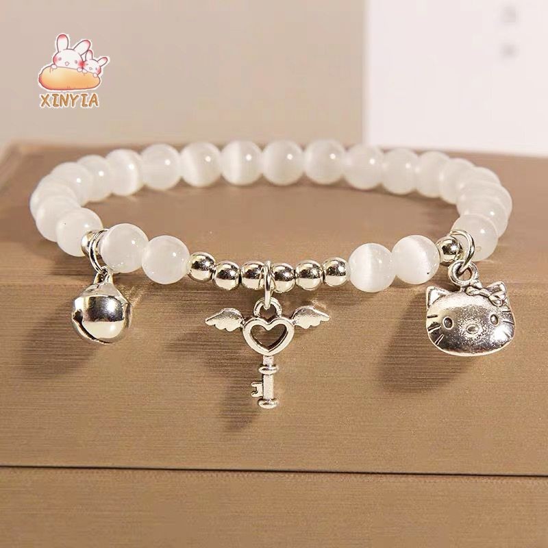 Kittyสร้อยข้อมือรูปหัวใจจี้กระดิ่งประดับลูกปัดตาแมวลายเฮลโลคิตตี้เหมาะกับของขวัญสําหรับเด็กผู้หญิงเครื่องประดับแฟชั่น2024ใหม่XINYIA
