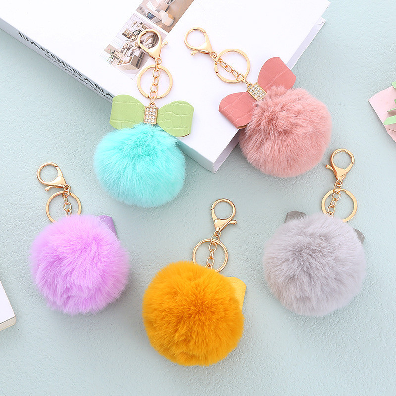 น่ารัก Rhinestone Bowknot พวงกุญแจ Plush Faux กระต่ายขนสัตว์ Pompon Hairball Fluffly Key แหวนสําหรับสาวกระเป๋าจี้รถ